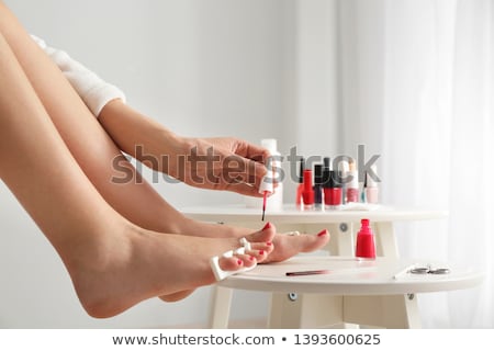 Сток-фото: Foot Pedicure Applying Womans Feet In Toe Separators