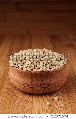 Сток-фото: Green Buckwheat In Wooden Bowl On Brown Bamboo Board Close Up Rustic Style Healthy Dietary Groats