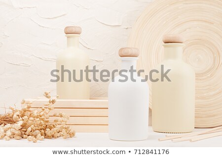 Foto stock: Blank White Beige Cosmetics Bottles With Spikelets On White Wood Board Copy Space Mock Up