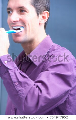 Foto stock: Man Brushing His Teeth Head Cropped