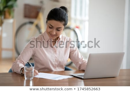 Stock photo: Businesswoman Filling The Invoice Form On Laptop