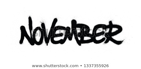 Stock fotó: Graffiti November Word Sprayed In Black Over White