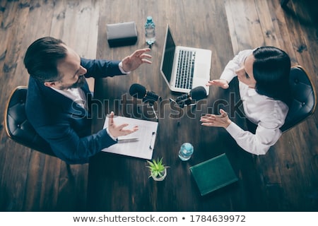 Stok fotoğraf: News Reporter Asking Questions To Businesswoman