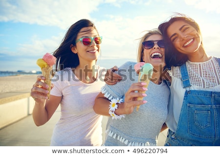 Stok fotoğraf: Happy Friends Eating Ice Cream On Beach