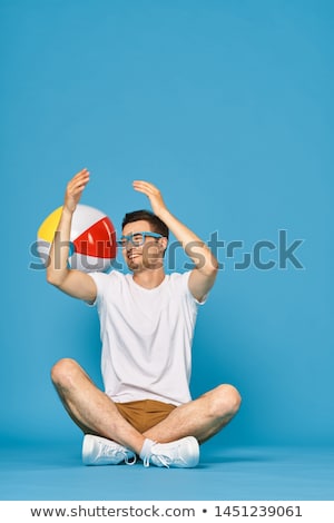 Foto stock: Man Holding Beachball