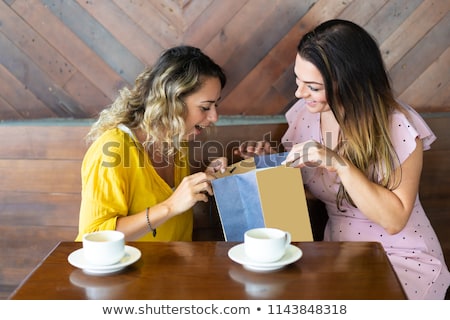 Stock photo: Lady Peeping Into Gift Bags