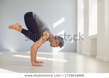 Stock fotó: Man Practices Yoga