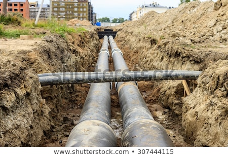 Stock foto: Maintenance Of Industrial Pipes For Heating Water Transport