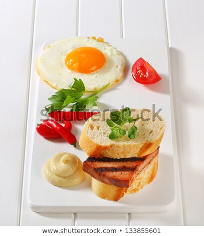 Stockfoto: Grilled Leberkase Sandwich With Mustard And Fried Egg