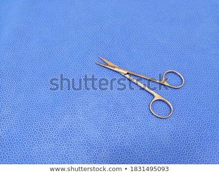 Foto stock: Scissors With Blue Finger Rings