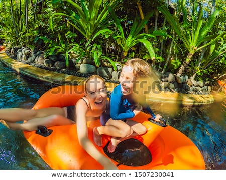 Stock fotó: Mom And Son Have Fun At The Water Park