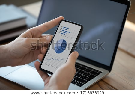 Stock photo: Stock Market Broker Analyzing Graphs On Laptop