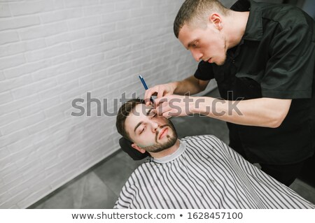 Stock fotó: Hairdresser Shaving With Straight Razor