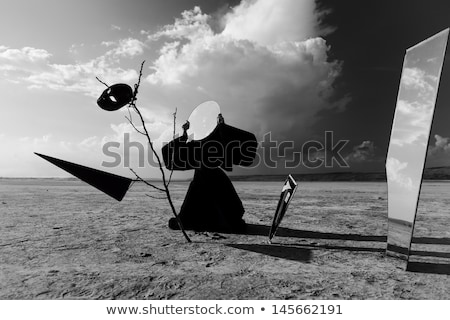 Foto stock: Masked Figure Broken Mirror