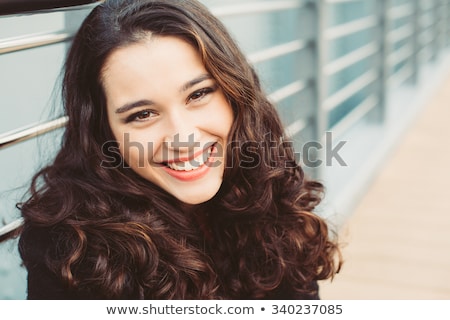 Foto stock: Cheerful Beautiful Young Brunette Woman With Brown Eyes And Long Hair