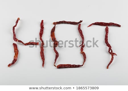 Foto d'archivio: Word Cayenne Pepper Written In Powder