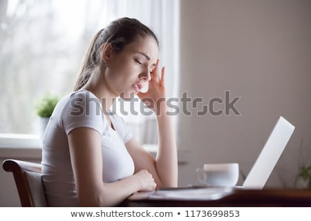[[stock_photo]]: Working Overtime A Woman Has A Headache