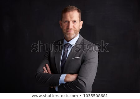 Foto stock: Etrato, · de, · un, · hombre · de · negocios, · en, · un, · traje · oscuro