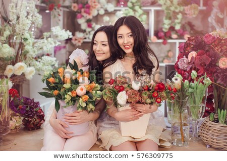 Stockfoto: Beautiful Asian Women Florists With Bouquet Of Flowers In Flower Store