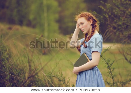 Foto stock: Portrait Of A Young Woman Blonde Glasses Outdoors In The Park