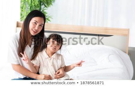 Stok fotoğraf: Girls And Their Mother Enjoy Sunny Morning