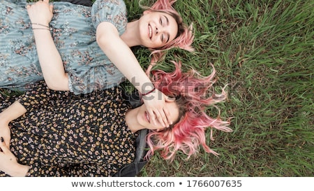 Happy Friendly Young Woman In A Floral Top Stok fotoğraf © Alones