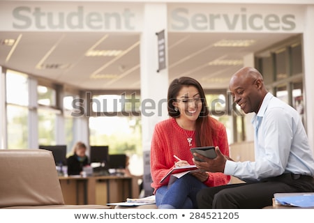 Stock photo: Two Students Having Discussion With Teacher