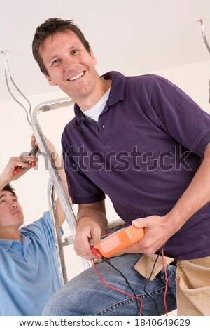 Stock foto: Electrician Posing By His Equipment