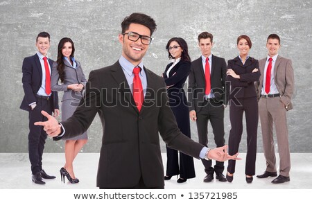 Stock photo: Happy Young Man Welcoming You To His Group Of Friends