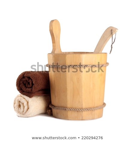 Stockfoto: Wooden Bucket With Ladle For The Sauna And Stack Of Clean Towels