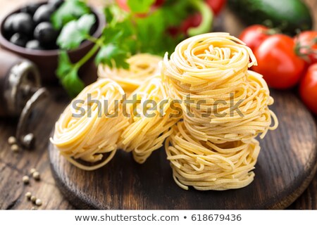 ストックフォト: Raw Alluovo Pasta Egg Noodles With Cooking Ingredients On Dark Wooden Rustic Background Tradition