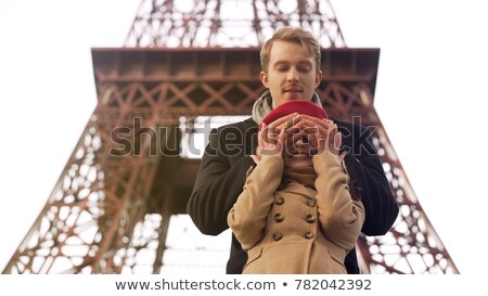 Zdjęcia stock: Guy Creeping Behind Girlfriend And Closing Her Eyes Making Surprise On Date