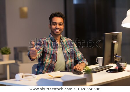 [[stock_photo]]: Smiling Indian Man Showing Thumbs Up At Office