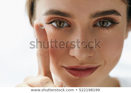 Сток-фото: Woman Holding Contact Lens