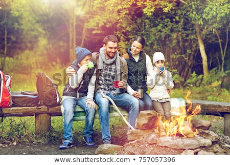 Сток-фото: Family With Backpacks And Thermos At Campfire