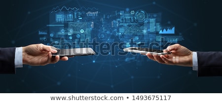 Сток-фото: Close Up Of Two Hands Holding Smartphones
