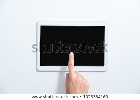 ストックフォト: Finger Touching Tablet With White App Icons Above