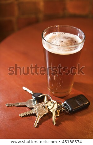 Car Keys In Pint Glass Imagine de stoc © iofoto