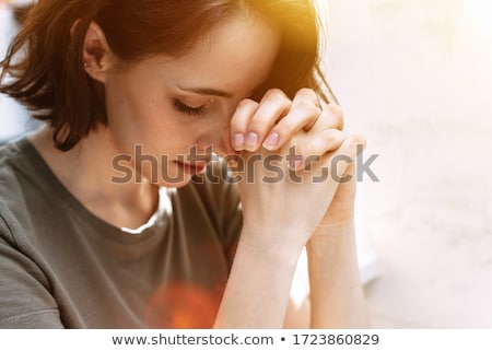 [[stock_photo]]: Beautiful Young Woman With Hands Folded Asking For Help