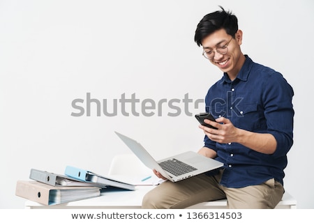 Stock foto: Young Asian Businessman Holding Laptop