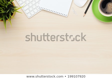 Сток-фото: Office Table With Coffee Cup Computer And Flower