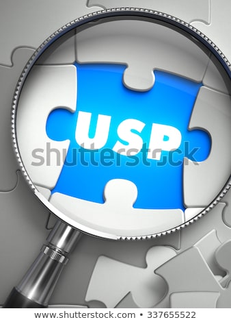 Stok fotoğraf: Benefit - Puzzle With Missing Piece Through Loupe