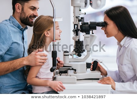 Stock photo: Optometrist Examines The Sight Of Young Girl