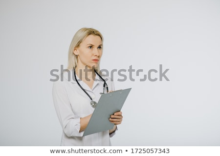 Сток-фото: Female Doctor In White Uniform Posing With Blank Clipboard Pad