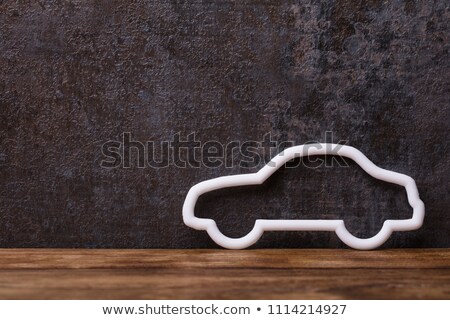 [[stock_photo]]: Hollow White Car On Wooden Desk