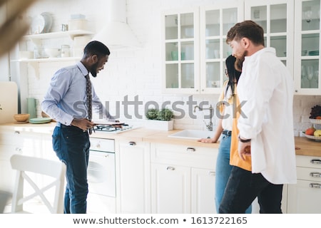 Сток-фото: Realtor Showing House To A Young Couple