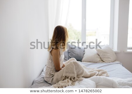 Сток-фото: Happy Young Woman Enjoying Sunny Morning On The Bed