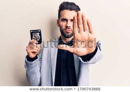 Stockfoto: Male Spy Showing Stop Sign