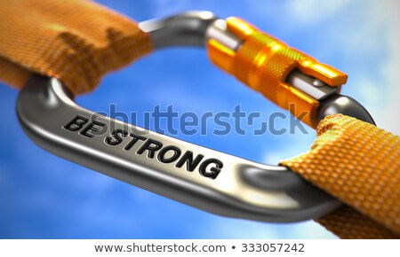Stockfoto: Be Strong On Chrome Carabine With A Orange Ropes