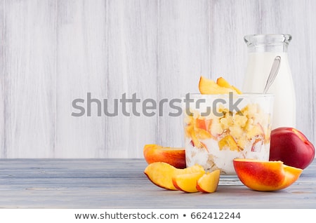 Stockfoto: Soft Breakfast With Corn Flakes Slice Peach And Milk Bottle On White Wood Board Decorative Border